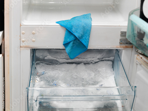 Defrosting and cleaning freezer photo