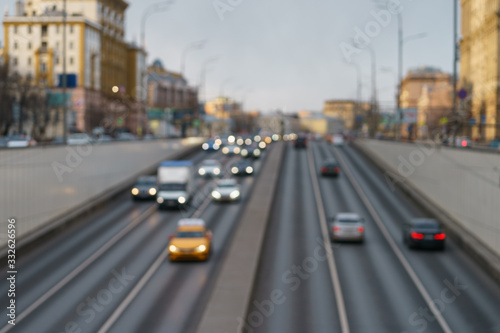 Defocused photography of the big traffic on the city street. Road is filled our by cars. Rush hours. Lifestyles of big city concepts. Frontal and back view