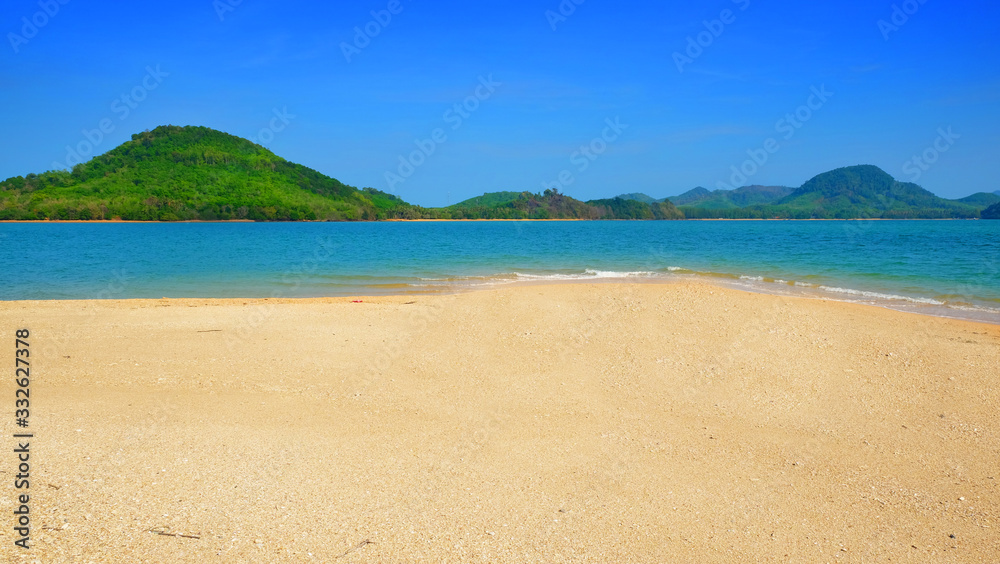 Clear sand beach form tropical island view background on summer season.