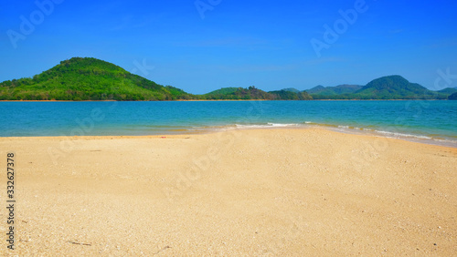 Clear sand beach form tropical island view background on summer season.