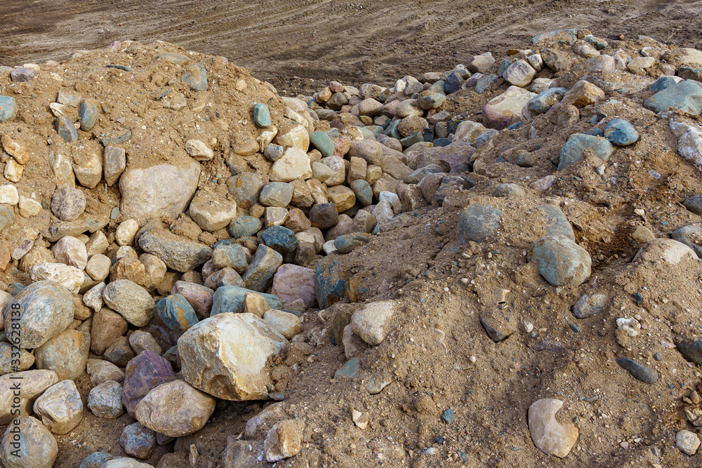 pile of cobblestones with sand