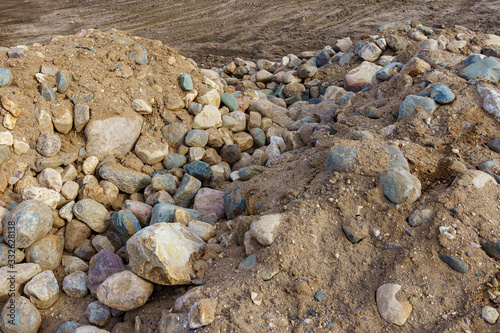 Obraz na płótnie pile of cobblestones with sand w salonie