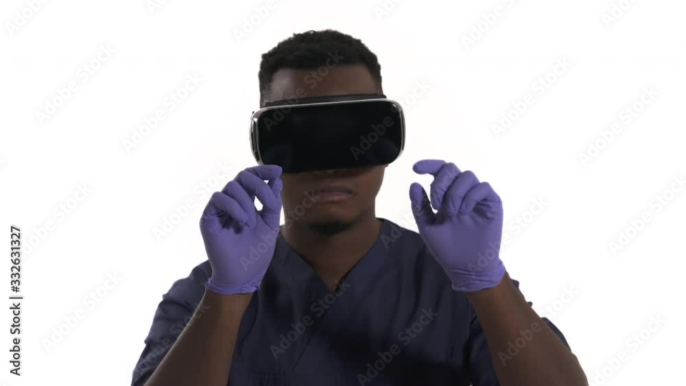 Doctor in VR goggles touching virtual objects. 3D cyber technologies in medicine. Isolated, on white background