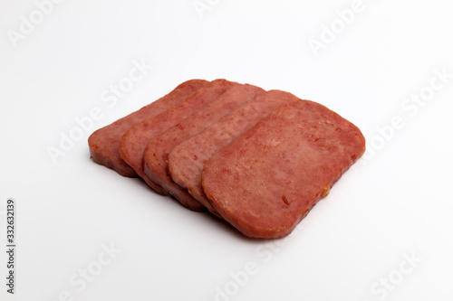 Baked canned ham on white background