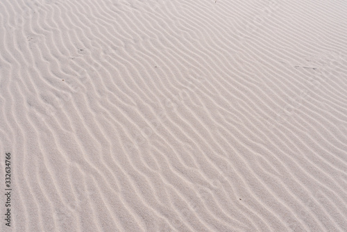 Waves of sand on the beach