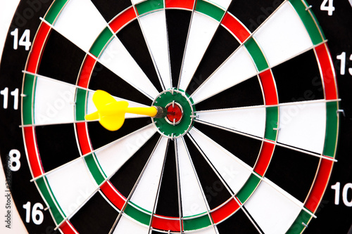 dartboard with darts in center