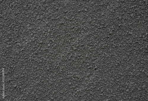 background and texture of black sand spray on decorative wall