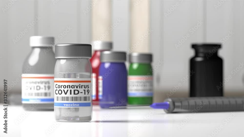 Covid 19 Coronavirus Vaccination. Medical injection syringe and vials with vaccine background. HD footage