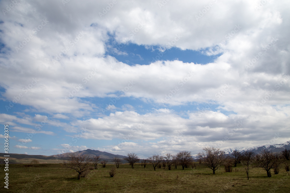 Early spring, mountains and hills of Kypgyzstan. Blue sky, beautiful nature