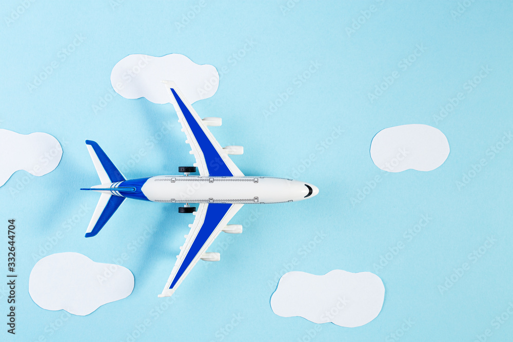 Model plane, airplane on blue pastel color background. Summer travel or vacation concept.