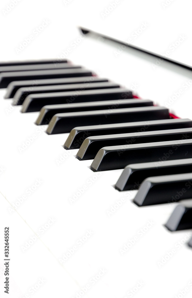 close-up of piano keys. close frontal view, black and white piano keys, viewed from side close-up of piano keys. close frontal view, black and white piano keys, viewed from side