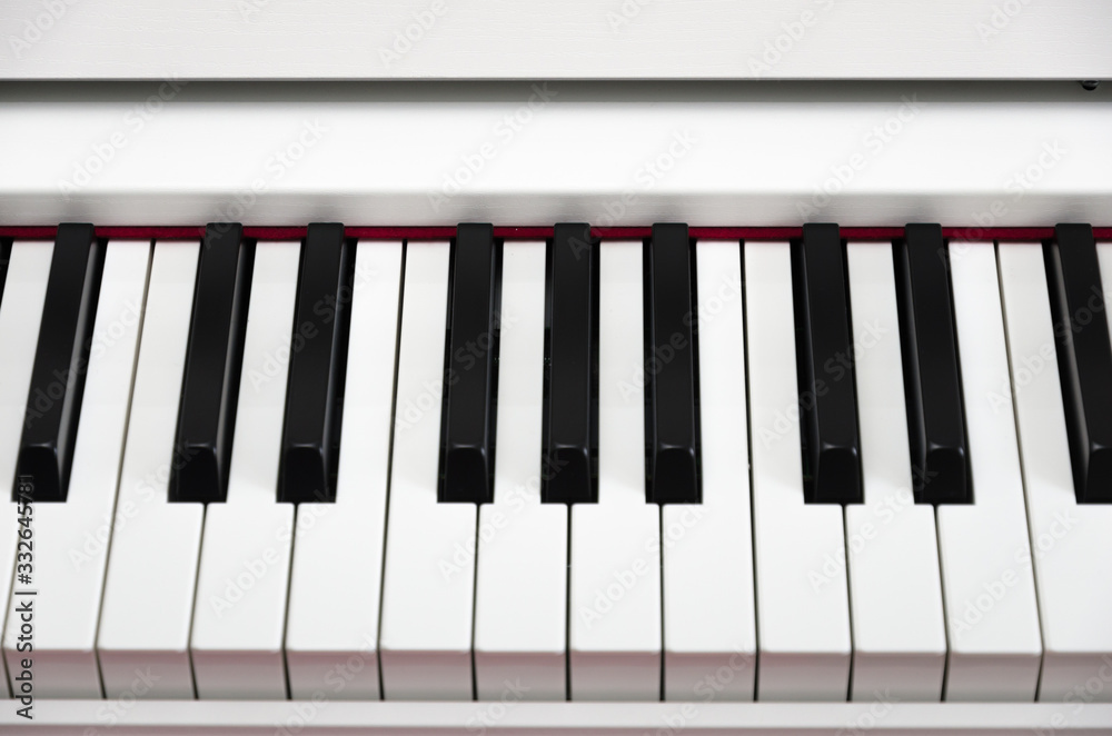 close-up of piano keys. close frontal view, black and white piano keys, viewed from above, top view close-up of piano keys. close frontal view, black and white piano keys, viewed from above, top view