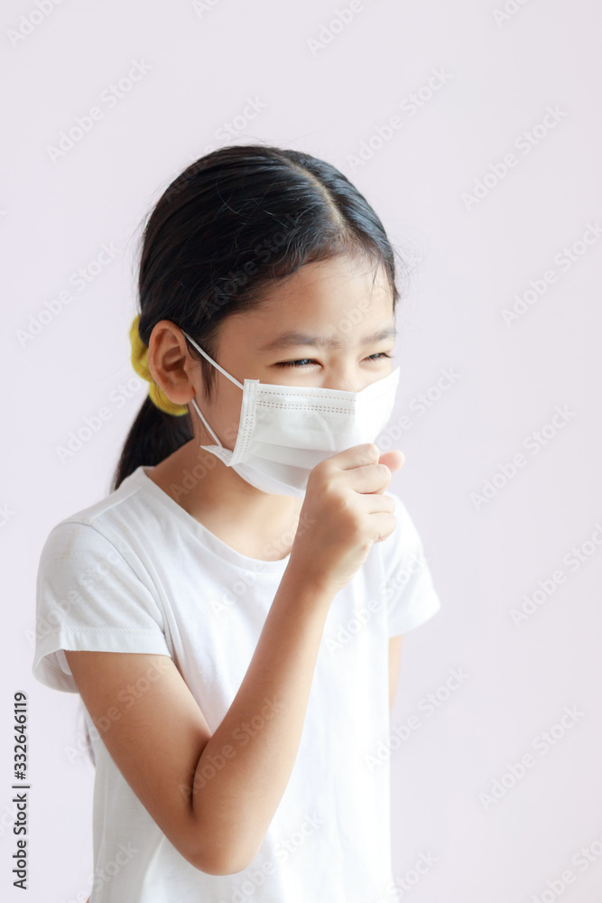 Portrait of a Children wearing sanitary masks and coughs Portrait of a Children wearing sanitary masks and coughs