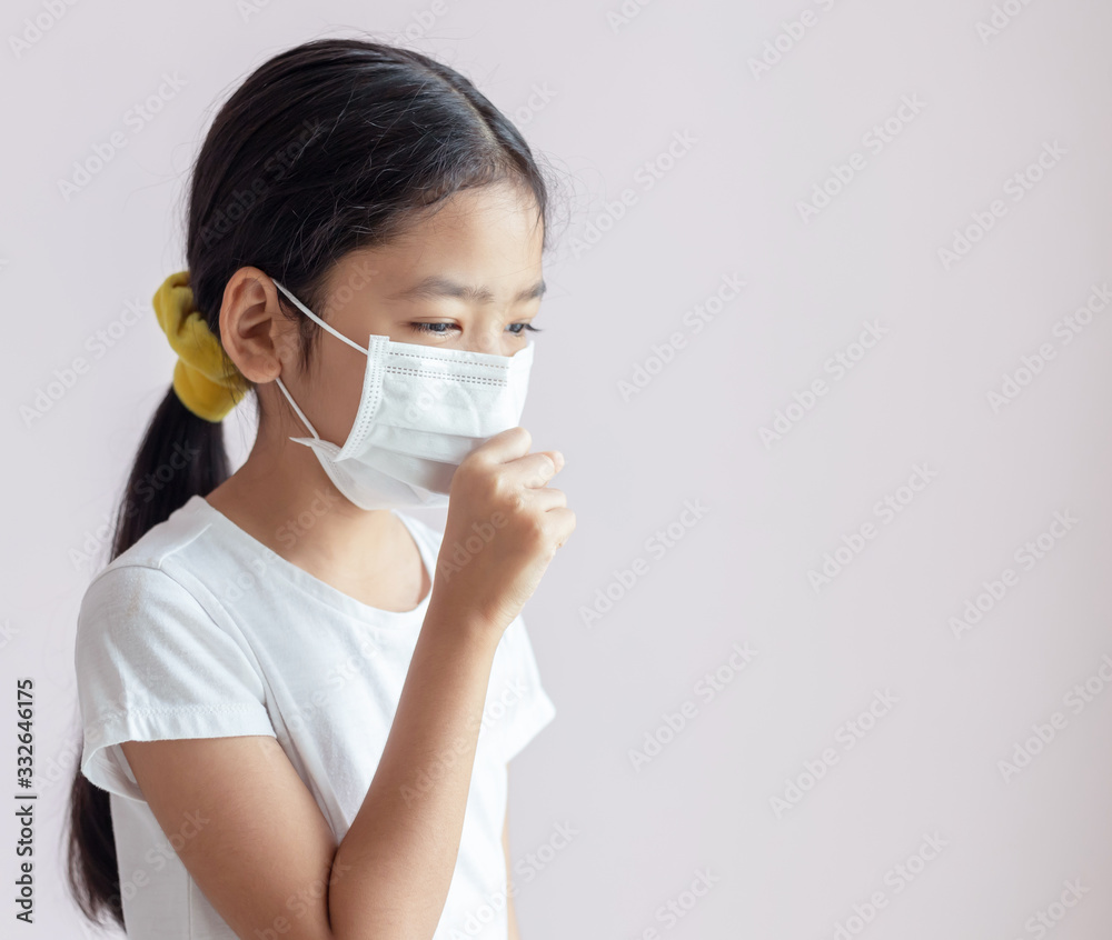 Portrait of Children wearing sanitary masks and coughs