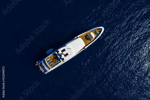 Aerial drone top down photo of Luxury Yacht boat near the famous island of Capri, Italy. © iAmTasweer