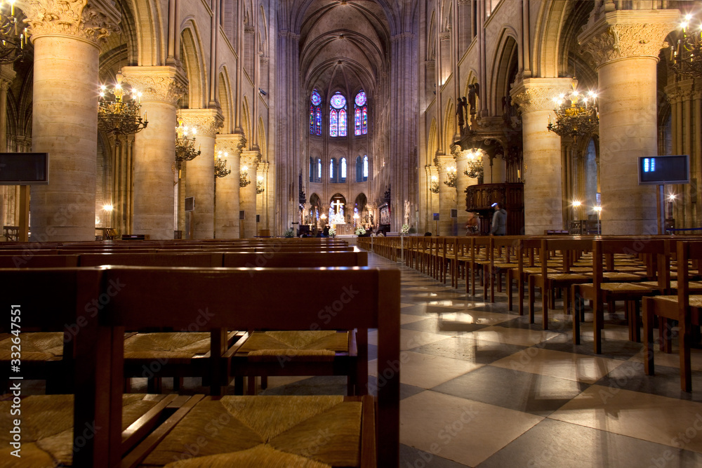 Paris, Ile de la Cite, France - Empty chairs at the interior of Notre Dame Cathedral.