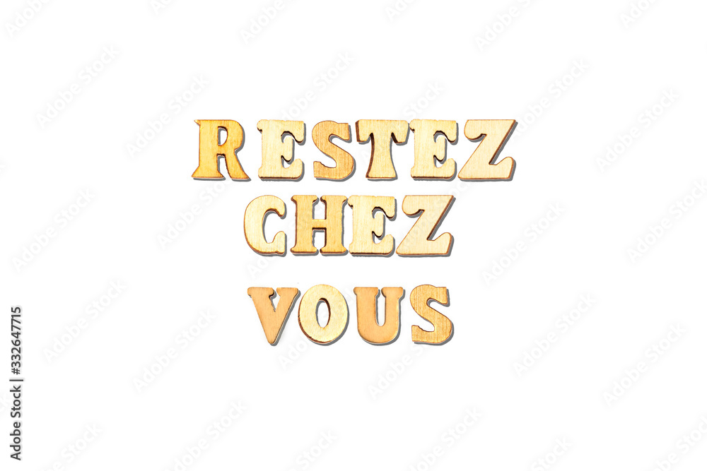 forming french word restez chez vous translated in english stay at home with wooden alphabets 