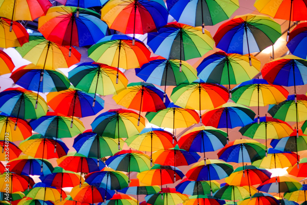 Naklejka premium colorful umbrellas hanging
