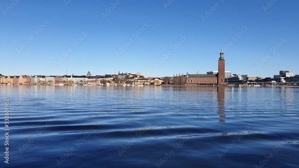 Panoramic view of the sea bay and the city against the blue sky. Spring Sweden