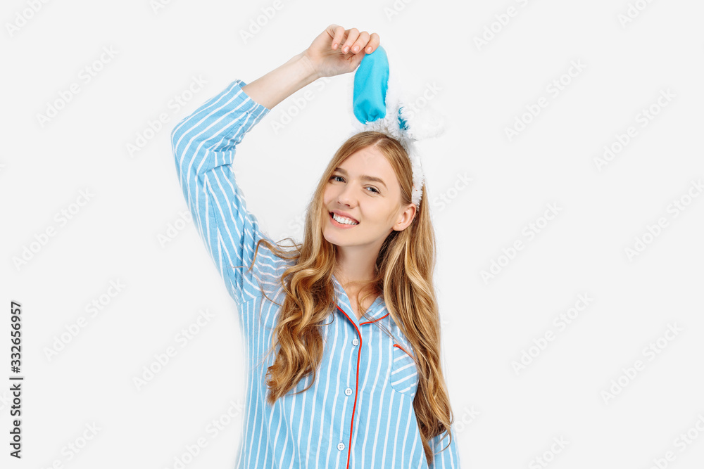 Portrait of a cute beautiful girl in pajamas, with Bunny ears on her head, a beautiful and cheerful woman in pajamas Portrait of a cute beautiful girl in pajamas, with Bunny ears on her head, a beautiful and cheerful woman in pajamas