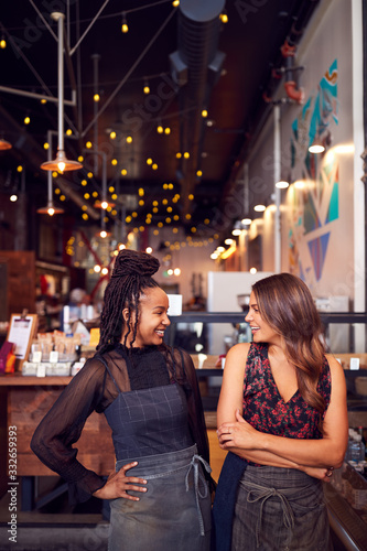 Two Female Coffee Shop Owners Standing At Sales Desk © Monkey Business