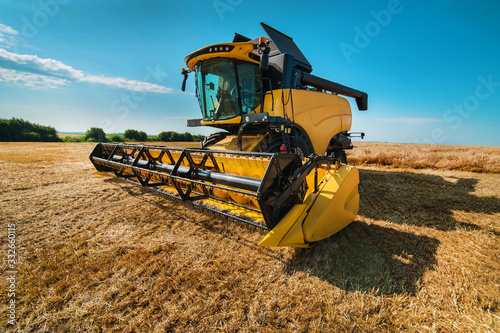 A close look of a modern combine harvester, wide angle