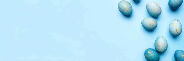 Easter frame of eggs painted in blue color. Flat lay, top view. Copy space for text.