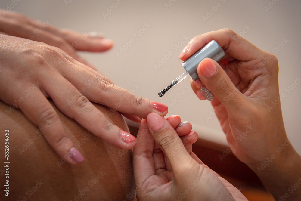 Nail beautician for customers before the wedding Nail beautician for customers before the wedding