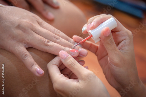 Nail beautician for customers before the wedding