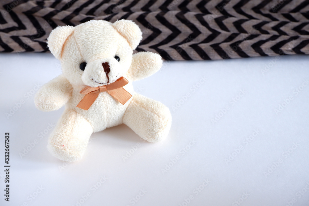 Fototapeta premium A soft beige bear is sitting there. Children's toy