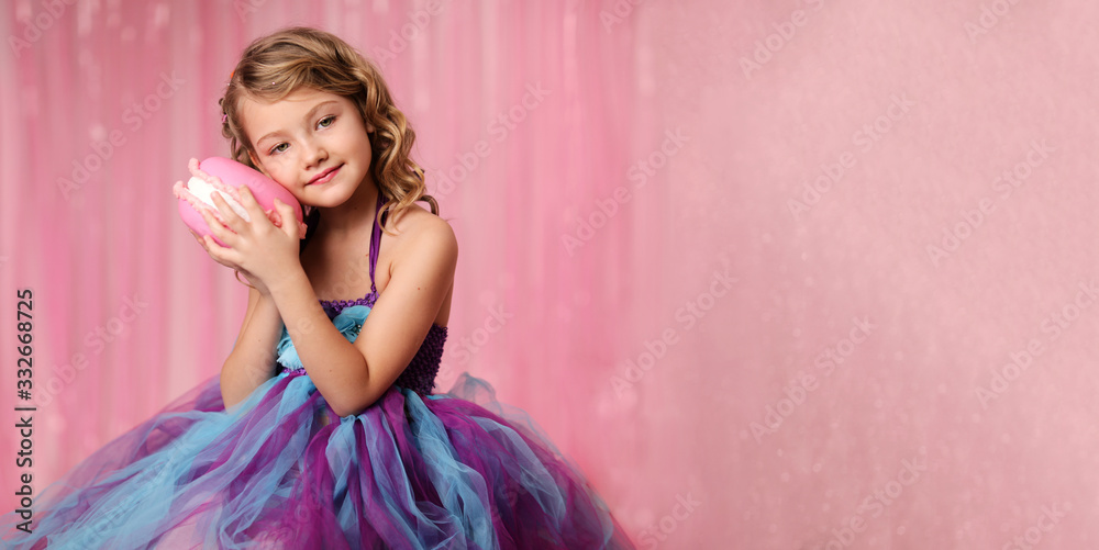 portrait of a girl-model, having fun at a birthday party in a beautiful, delicious, pink candy interior, the concept of themed children's holidays, participation in competitions. banner portrait of a girl-model, having fun at a birthday party in a beautiful, delicious, pink candy interior, the concept of themed children's holidays, participation in competitions. banner