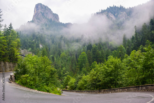 Bicaz Gorge road in Romania, is one of the most spectacular drives in the country, location in Carpathian mountain. The high cliffs of the gorge are divided by the mountain river Bicaz. photo