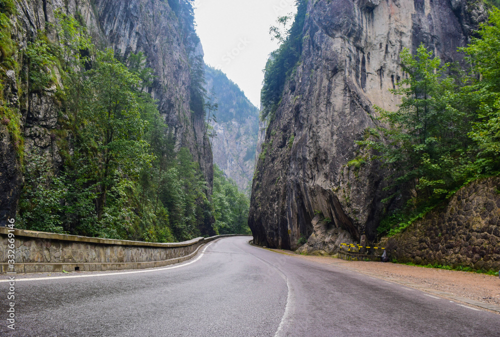 Bicaz Gorge road in Romania, is one of the most spectacular drives in the country, location in Carpathian mountain. The high cliffs of the gorge are divided by the mountain river Bicaz.