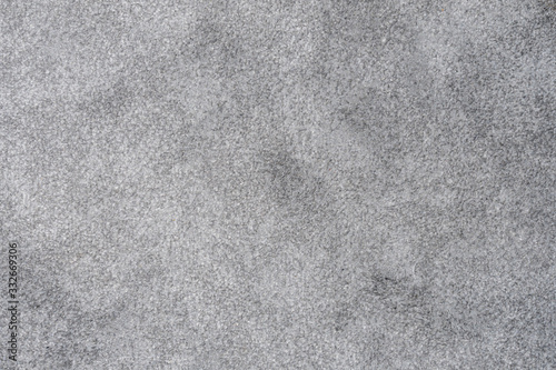 Carpet texture in different tones of medium grey soft and fluffy structure woven blanket