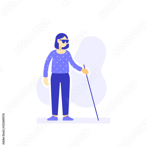 Blind woman with sunglasses and cane walking