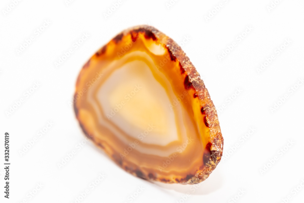 Slice of gem thin cut piece in different tones of yellow and orange and natural edges Slice of gem thin cut piece in different tones of yellow and orange and natural edges