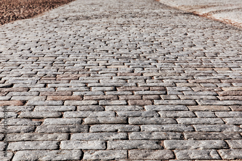 Fotografia Stone pavement texture, texture of cobblestone road