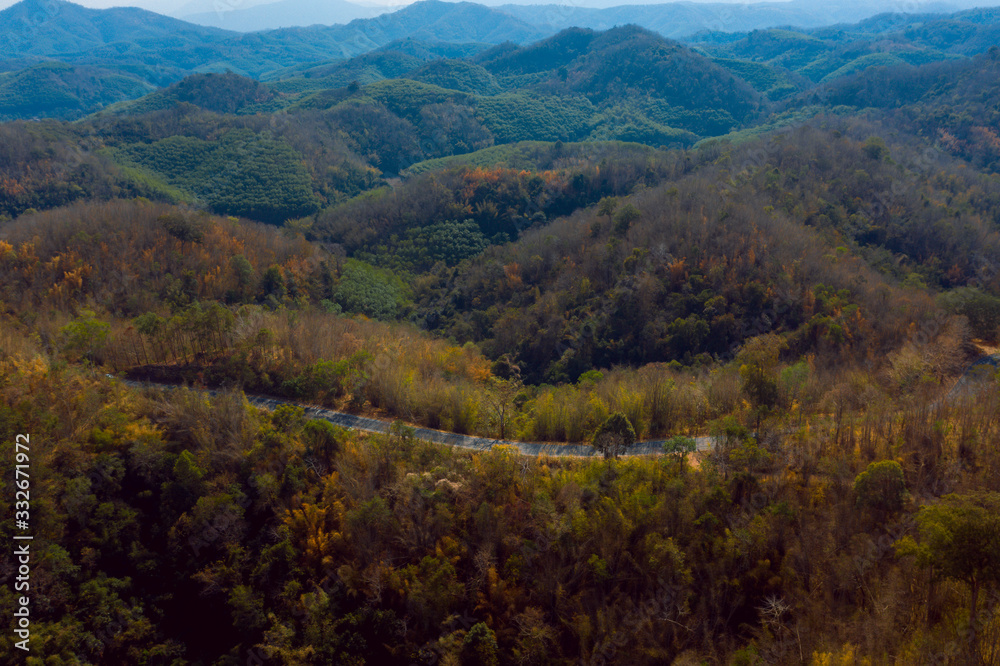 aerial view of thailand road, beautiful serpentine curvy road and moutain with autumn colors.