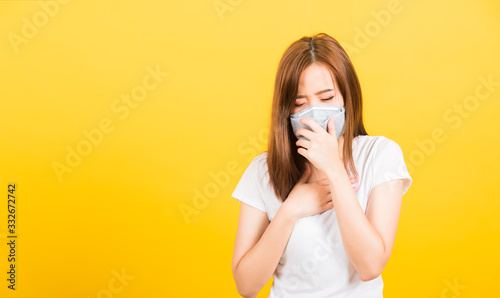 woman teen standing cough in mask protection from virus epidemic or air pollution