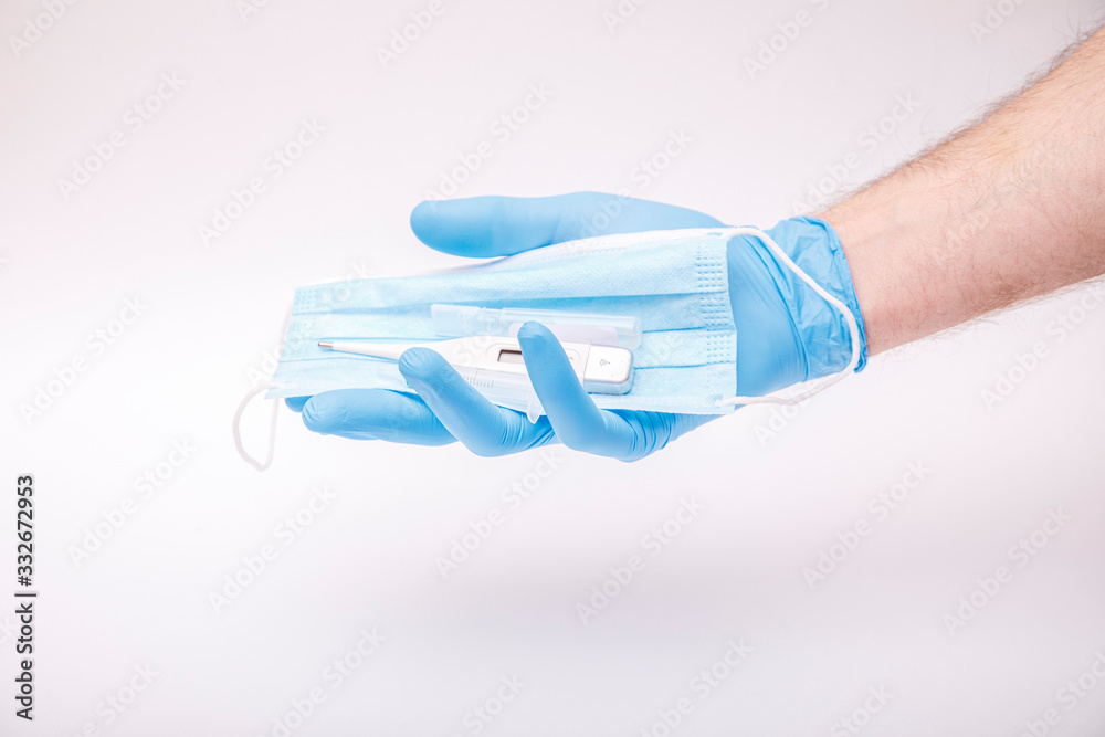 World Epidemic Danger. Protect face mask in hands, isolated on a white background. Human Epidemic Danger. World Epidemic Danger. Protect face mask in hands, isolated on a white background. Human Epidemic Danger.