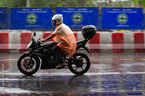 rains on the city on streets © anake