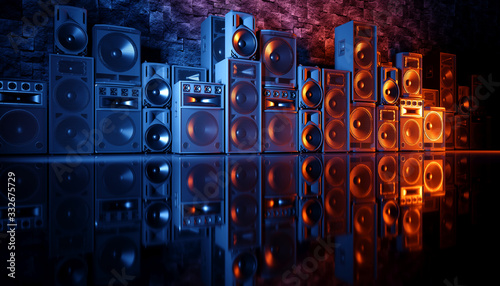 speaker system on a black background in blue and orange lighting