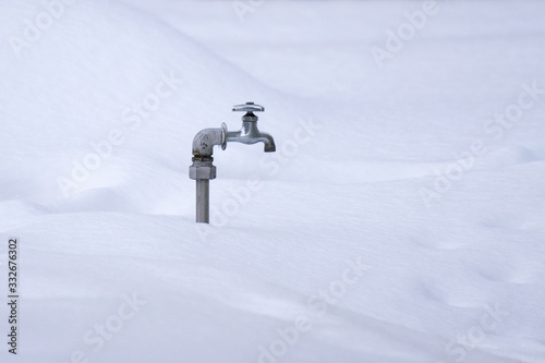 Water tap on snow in japan photo