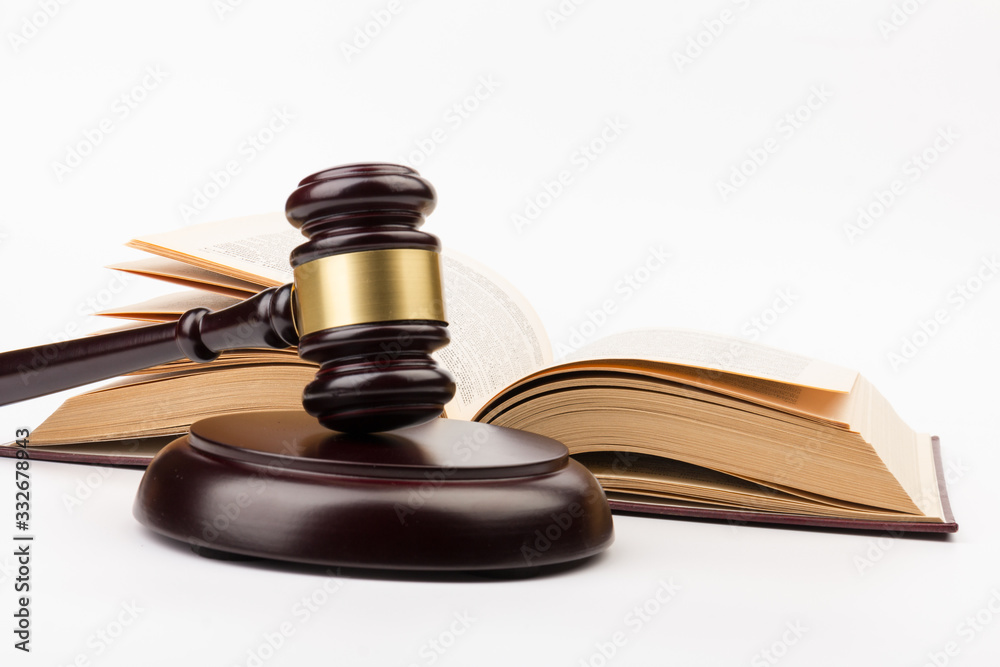 Wooden judges gavel on gray background in close up. Space for text Wooden judges gavel on gray background in close up. Space for text