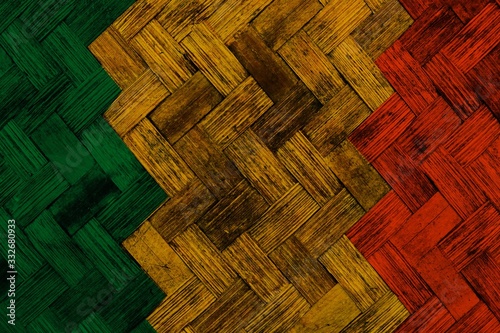 green yellow red reggae background on Wickerwork texture