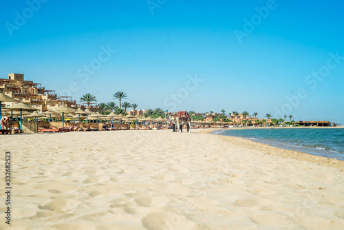 Fototapeta Naklejka Na Ścianę i Meble -  beach in sunset time.White sand, blue sky and ocean. Summer vacation. sea vacation. travel concept. The empty beaches of Egypt.