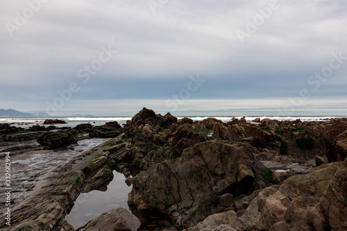 rocky beach in the basque country © larrui