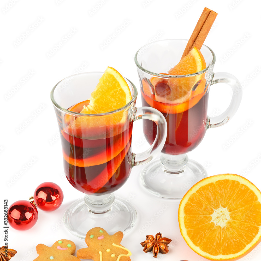 Mulled wine, orange, spices and gingerbread cookies isolated on a white background.