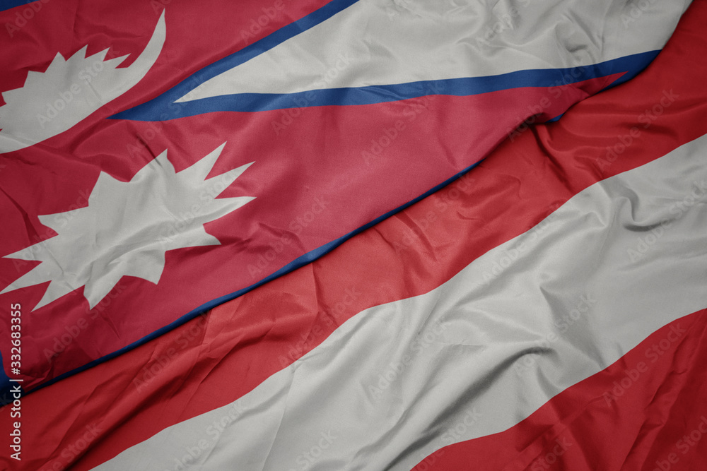 waving colorful flag of austria and national flag of nepal.