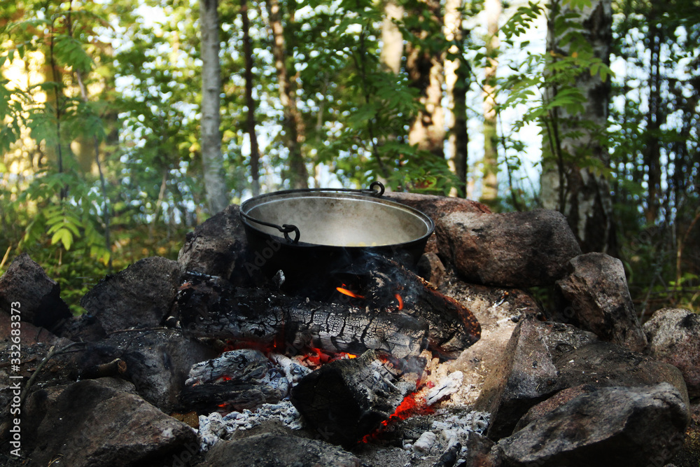 tourist bowler with food on the campfire tourist bowler with food on the campfire